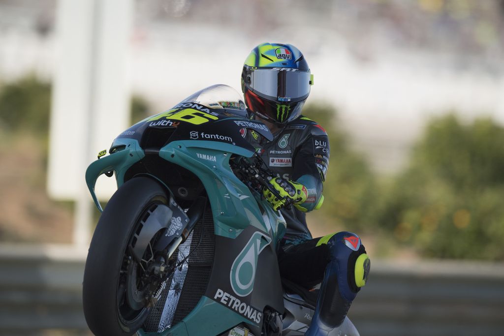 VALENCIA, SPAIN - NOVEMBER 13: Valentino Rossi of Italy and Petronas Yamaha SRT lifts the front wheel during the MotoGP of Comunitat Valenciana: Qualifying at Ricardo Tormo Circuit on November 13, 2021 in Valencia, Spain. (Photo by Mirco Lazzari gp/Getty Images)
