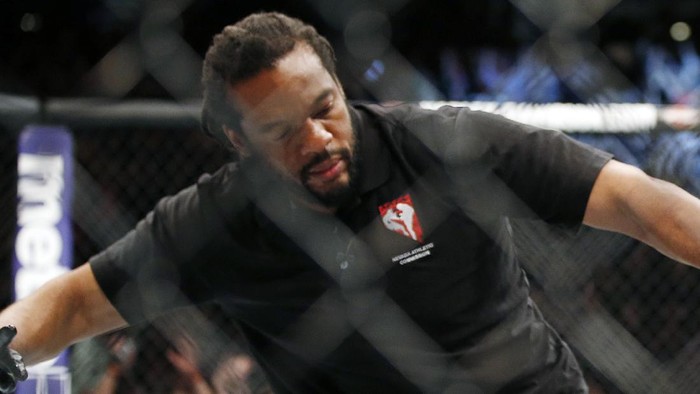 Referee Herb Dean stops the fight shortly after Nate Diaz defeats Conor McGregor in a second round submission victory during their UFC 196 welterweight mixed martial arts match, Saturday, March 5, 2016, in Las Vegas.  Diaz won by submission. (AP Photo/Eric Jamison)