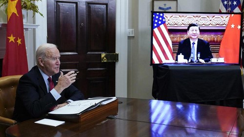 President Joe Biden meets virtually with Chinese President Xi Jinping from the Roosevelt Room of the White House in Washington, Monday, Nov. 15, 2021. (AP Photo/Susan Walsh)
