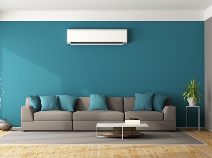 Modern living room with sofa and air conditioner - 3d rendering