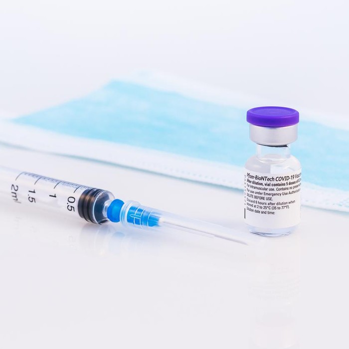 Brasov, Romania - February 21, 2021: Pfizer-BioNTech Covid-19 vaccine on a white background.
