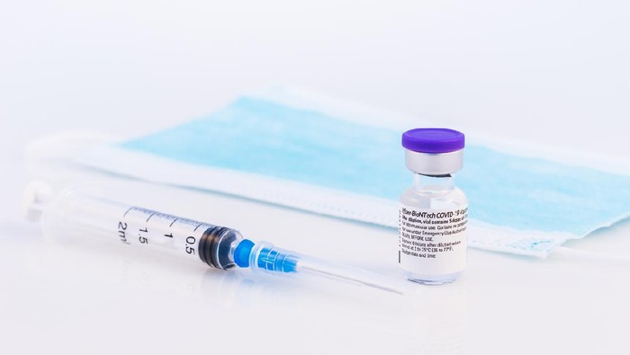 Brasov, Romania - February 21, 2021: Pfizer-BioNTech Covid-19 vaccine on a white background.