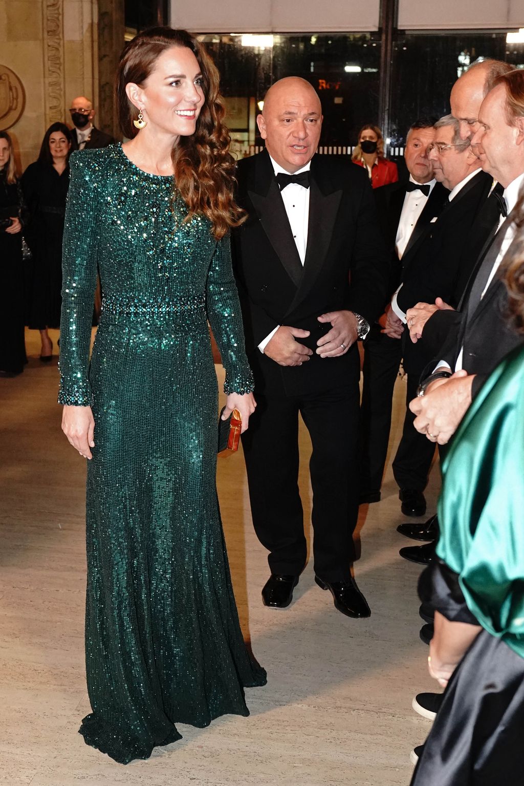 LONDON, ENGLAND - NOVEMBER 18: Catherine, Duchess of Cambridge is given a posy by 10 year old Poppy Clee and Rowan Clarke during the Royal Variety Performance at Royal Albert Hall on November 18, 2021 in London, England. (Photo by Jonathan Brady - WPA Pool/Getty Images)
