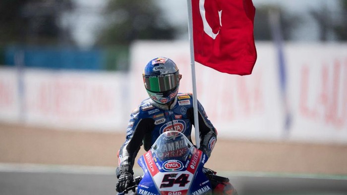 MAGNY-COURS, FRANCE - SEPTEMBER 05: Toprak Razgatlioglu of Turkey and Pata Yamaha with Brixx WorldSBK celebrates the victory with the flag during the WorldSBK race 2 during the WorldSBK France - Race 2 at Nevers Magny-Cours Circuit on September 05, 2021 in Magny-Cours, France. (Photo by Mirco Lazzari gp/Getty Images)