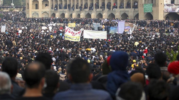 In this photo released by the semi-official Fars News Agency, farmers attend a protest demanding authorities open a dam to relieve drought-stricken areas of central province of Isfahan, on the dried up riverbed of the Zayandeh Roud river in the city of Isfahan 255 miles (410 kilometers) south of the capital Tehran, Iran, Friday, Nov. 19, 2021. Several prominent actors and athletes joined the peaceful movement, urging the government to intervene to aid famers increasingly suffering from droughts that have worsened over the years. (Hamidreza Nikoomaram/Fars News Agency via A