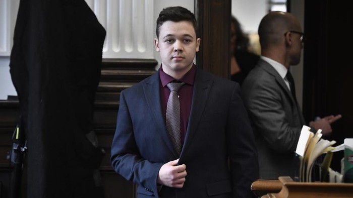 Kyle Rittenhouse enters the courtroom to hear the verdicts in his trial at the Kenosha County Courthouse in Kenosha, Wis., on Friday, Nov. 19, 2021. Rittenhouse has been acquitted of all charges after pleading self-defense in the deadly Kenosha shootings that became a flashpoint in the nation’s debate over guns, vigilantism and racial injustice. The jury came back with its verdict afer close to 3 1/2 days of deliberation. (Sean Krajacic/The Kenosha News via AP, Pool)