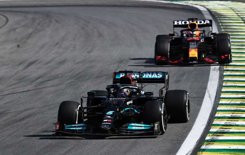Lewis Hamilton, Max Verstappen SAO PAULO, BRAZIL - NOVEMBER 14: Lewis Hamilton of Great Britain driving the (44) Mercedes AMG Petronas F1 Team Mercedes W12 leads Max Verstappen of the Netherlands driving the (33) Red Bull Racing RB16B Honda during the F1 Grand Prix of Brazil at Autodromo Jose Carlos Pace on November 14, 2021 in Sao Paulo, Brazil. (Photo by Buda Mendes/Getty Images)