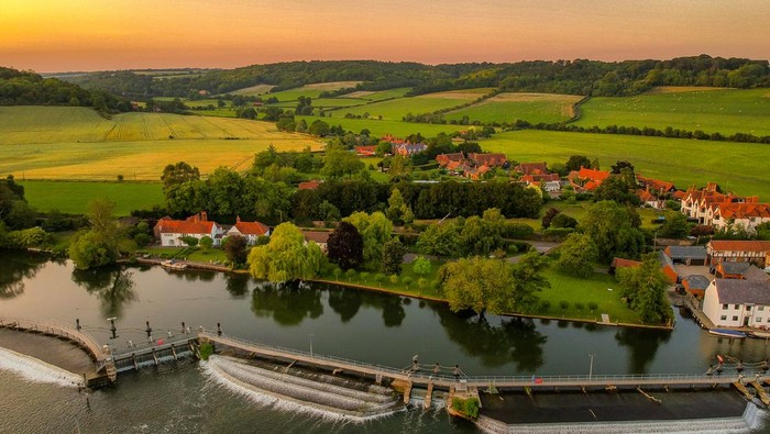 Hambledon, Buckinghamshire on the River Thames at sunset in the summer.