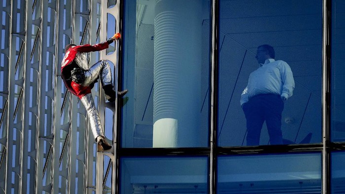 French urban climbers Alain Robert, left, well known as 