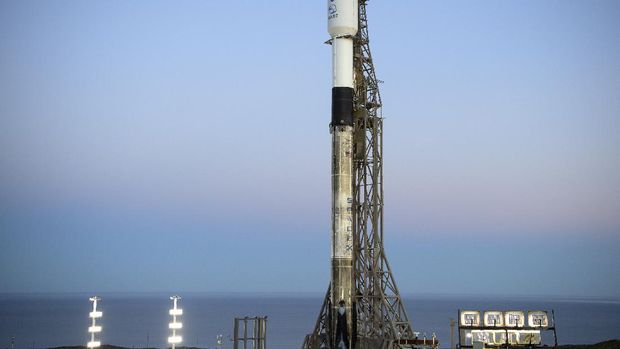In this image provided by NASA, a SpaceX Falcon 9 rocket with the Double Asteroid Redirection Test, or DART, spacecraft onboard, sits during sunrise, Tuesday, Nov. 23, 2021, at Space Launch Complex 4E, Vandenberg Space Force Base, Calif. The A spacecraft is scheduled to launch Tuesday night on a collision course with an asteroid in the first test of whether Earth can be protected from a potentially disastrous impact by slightly altering the trajectory of a space rock.  (Bill Ingalls/NASA via AP)