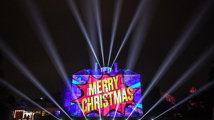 EDINBURGH, SCOTLAND - NOVEMBER 25: Merry Christmas is seen projected on to Inverleith House at the Royal Botanic Gardens Edinburgh on November 25, 2021 in Edinburgh, Scotland. The 2021 Christmas at the Botanics trail officially opens its doors today [25 November] until 2nd January 2022 unveiling several new magical attractions alongside many festive favourites at the Royal Botanic Garden Edinburgh.   (Photo by Peter Summers/Getty Images)