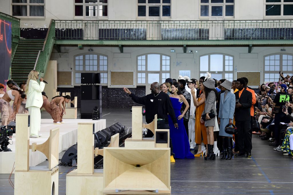 PARIS, FRANCE - JULY 04: Creative Director Virgil Abloh acknowledges the audience with models during the performance of British-Sri Lankan rapper Mathangi 