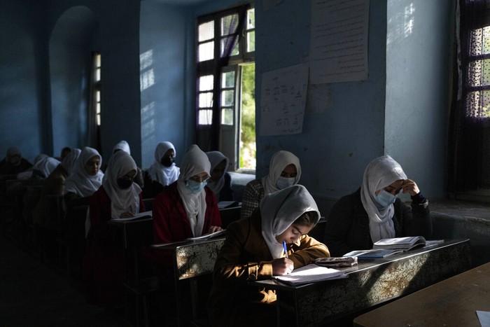 Afghanistan Educating Girls Afghan girls participate a lesson at Tajrobawai Girls High School, in Herat, Afghanistan, Thursday, Nov. 25, 2021. While most high school girls in Afghanistan are forbidden to attend class by the country's Taliban rulers, one major exception are those in the western province of Herat. For weeks, girls there have been attending high school classes, thanks to a unique effort by teachers and parents to persuade local Taliban administrators to allow schools to reopen. (AP Photo/Petros Giannakouris)