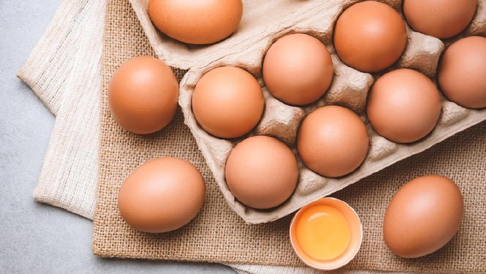 Top view and close up image of organic chicken eggs are one of the food ingredients on the restaurant table in the kitchen to prepare for cooking. Organic chicken eggs food ingredients concept