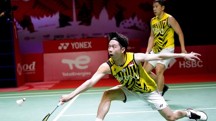 Indonesia's Kevin Sanjaya Sukamuljo, left, and Marcus Gideon compete against Taiwan's Lee Yang and Wang Chi Lin compete during their men's doubles Group A badminton match at the BWF World Tour Finals in Nusa Dua, Bali, Indonesia, Wednesday, Dec. 1, 2021. (AP Photo/Dita Alangkara)