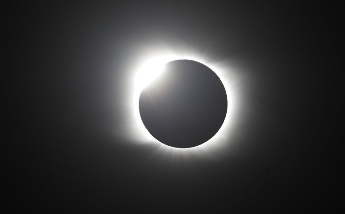 The moon covers the sun during a total solar eclipse in Piedra del Aguila, Argentina, Monday, Dec. 14, 2020. The total solar eclipse was visible from the northern Patagonia region of Argentina and from Araucania in Chile, and as a partial eclipse from the lower two-thirds of South America. (AP Photo/Natacha Pisarenko)