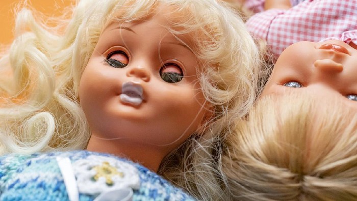 close up girl toy doll face flay lay