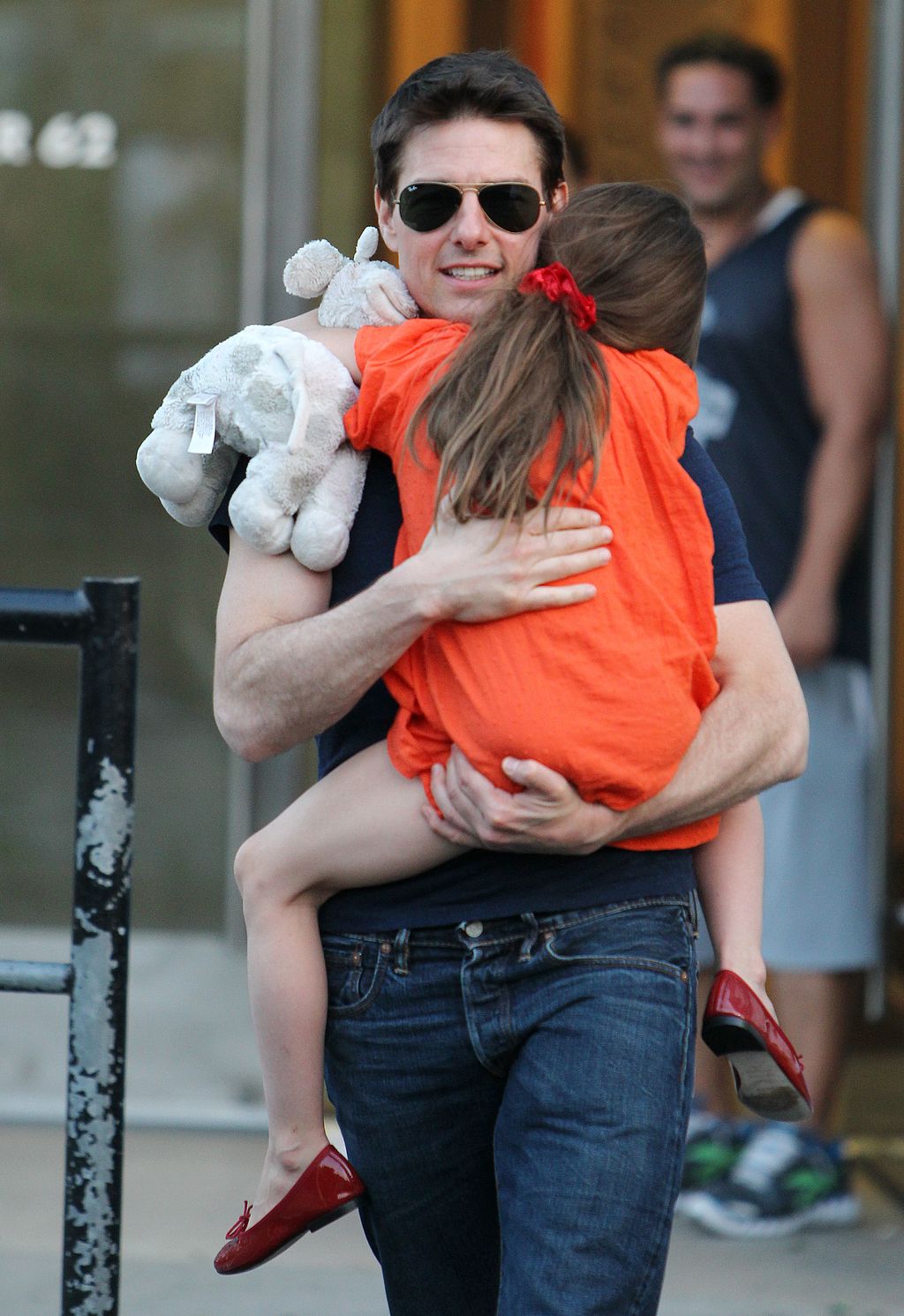 FILE -  In this Nov. 4, 2007 file photo, actress Katie Holmes joins her husband Tom Cruise as he holds their daughter Suri after Holmes finished the New York City Marathon in New York. Holmes' attorney Jonathan Wolfe said Friday June 29, 2012 that the couple is divorcing, but called it a private matter for the family. (AP Photo/Kathy Willens, file)
