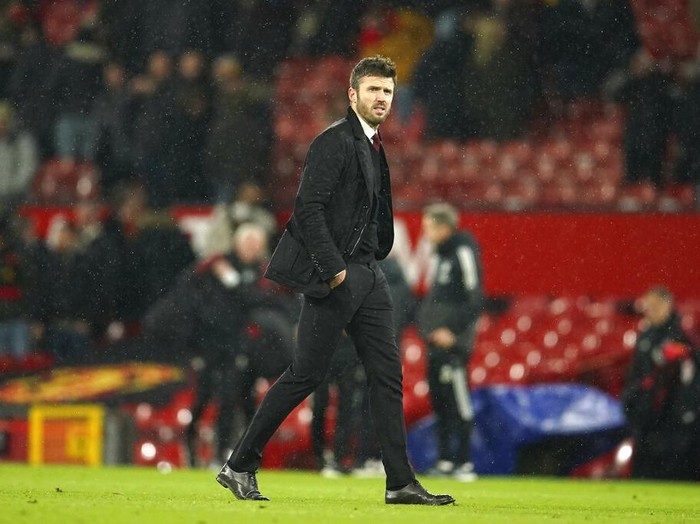 Manchester Uniteds temporary coach Michael Carrick walks off the pitch at the end of the English Premier League soccer match between Manchester United and Arsenal at Old Trafford stadium in Manchester, England, Thursday, Dec. 2, 2021. United won the match 3-2. (AP Photo/Dave Thompson)