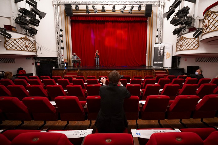 Inmates perform in the final rehearsal fo the play Anyone Can Make Mistakes by Romanian author Mircea Rotaru at the Nottara Theatre in Bucharest, Romania, Wednesday, Nov. 24, 2021. A drama festival organized by the National Penitentiary Administration of Romania gives prisoners the opportunity to appear in theater productions overseen by professional directors. The Multiart festival was organized to combat stereotypes about people serving time in the penal system and to offer them a route to reintegration. (AP Photo/Andreea Alexandru)