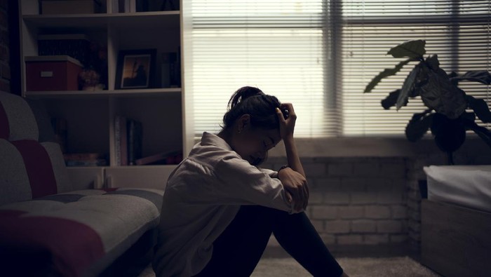 947804676 Business woman is depressed. She felt stressed and alone in the house.