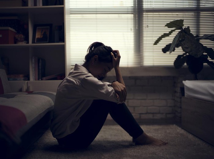 Business woman is depressed. She felt stressed and alone in the house.