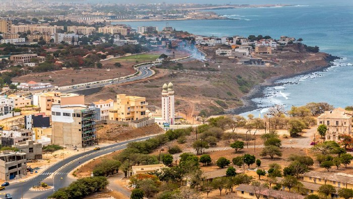 Aerial view of the city of Dakar, Senegal, showing the densely packed buildings and a highway