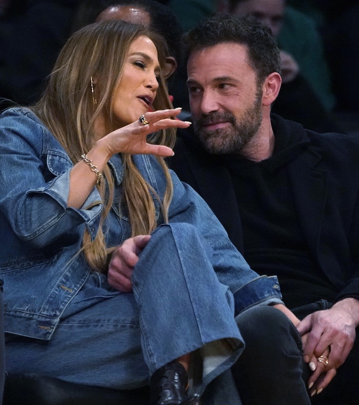 Jennifer Lopez, left, and Ben Affleck attend an NBA basketball game between the Los Angeles Lakers and the Boston Celtics Tuesday, Dec. 7, 2021, in Los Angeles. (AP Photo/Marcio Jose Sanchez)