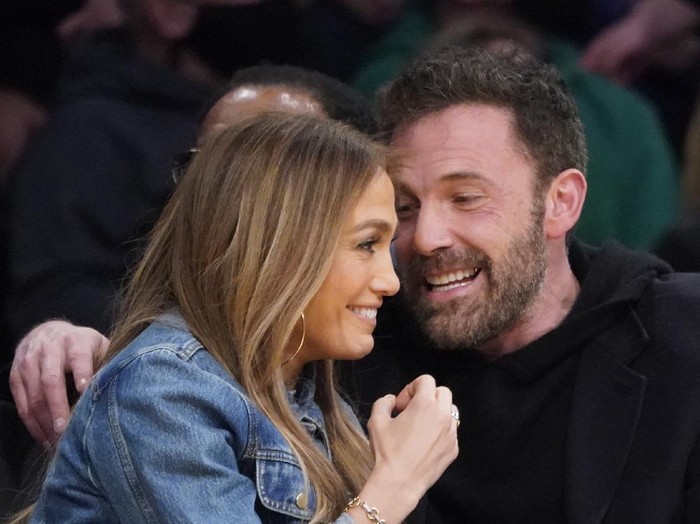Jennifer Lopez, left, and Ben Affleck attend an NBA basketball game between the Los Angeles Lakers and the Boston Celtics Tuesday, Dec. 7, 2021, in Los Angeles. (AP Photo/Marcio Jose Sanchez)