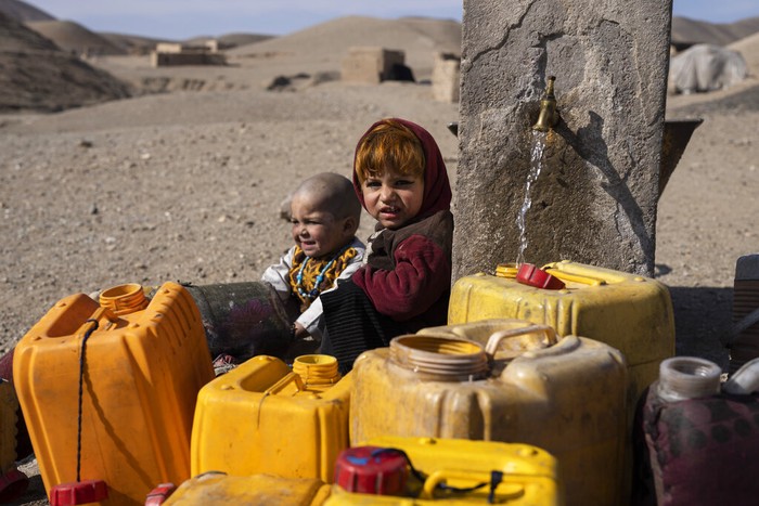 Afghanistan Running Dry The granddaughter of Hajji Wali Jan, 66, stands at the entrance of her house in Kamar Kalagh village outside Herat, Afghanistan, Friday, Nov. 26, 2021. Afghanistanβs drought, its worst in decades, is now entering its second year, exacerbated by climate change. (AP Photo/Petros Giannakouris)