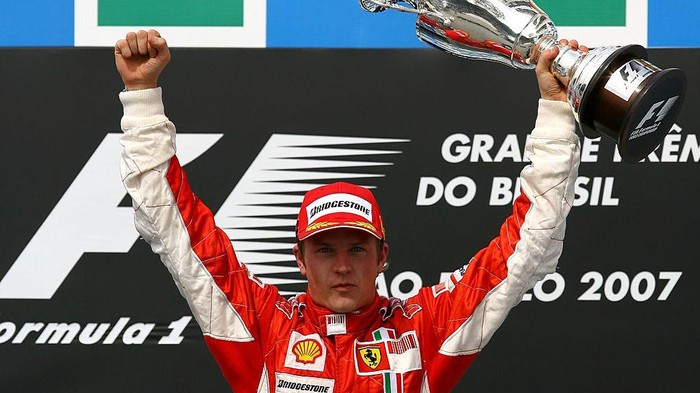 Kimi Raikkonen SAO PAULO, BRAZIL - OCTOBER 21: Kimi Raikkonen of Finland and Ferrari celebrates with the trophy on the podium after winning the race and the F1 World Championship at the Brazilian Formula One Grand Prix at the Autodromo Interlagos on October 21, 2007 in Sao Paulo, Brazil. (Photo by Paul Gilham/Getty Images)