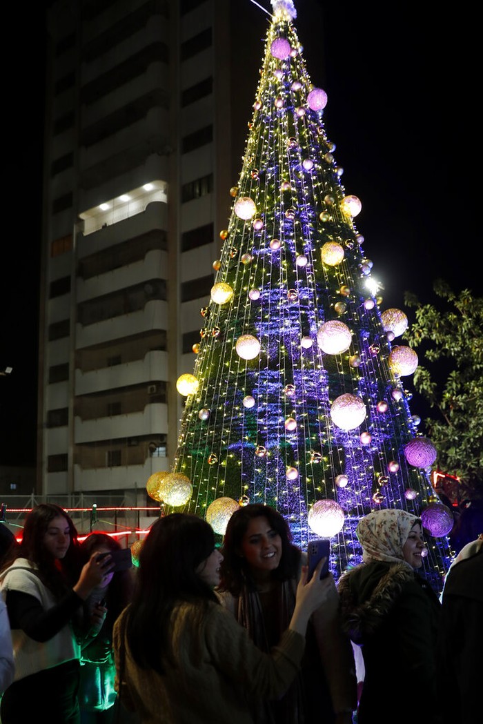 Palestinians Christmas Palestinians wear traditional uniforms perform a traditional folklore dance, Dabka, during while Christians celebrate lighting of the Christmas tree at the yard of Christian youth center in Gaza City, Friday, Dec. 10, 2021. (AP Photo/Adel Hana)