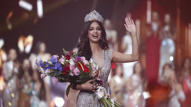 India's Harnaaz Sandhu waves after being crowned Miss Universe 2021 during the 70th Miss Universe pageant, Monday, Dec. 13, 2021, in Eilat, Israel. (AP Photo/Ariel Schalit)