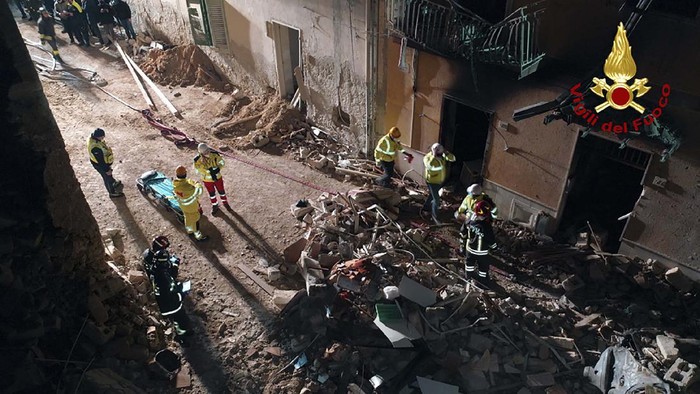 Italian firefighters and rescuers search for survivors among the rubble of a collapsed building, in Ravanusa, Sicily, Italy, Sunday, Dec. 12, 2021. (Italian Firefighters Vigili del Fuoco via AP)
