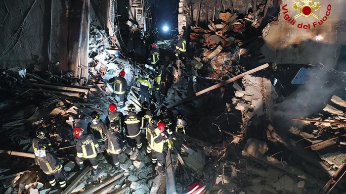 Italian firefighters and rescuers search for survivors among the rubble of a collapsed building, in Ravanusa, Sicily, Italy, Sunday, Dec. 12, 2021. (Italian Firefighters Vigili del Fuoco via AP)