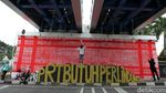 Mural Kain Serbet Sindir RUU Perlindungan PRT yang Belum Disahkan