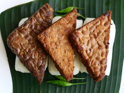 Jadah bacem on banan leaf. Jadah combined with tempe bacem. Indonesian food from yogyakarta.