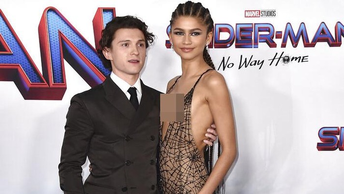 Tom Holland, left, and Zendaya arrive at the premiere of 