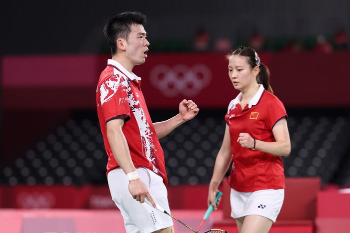 CHOFU, JAPAN - JULY 30: Zheng Si Wei and Huang Ya Qiong(right) of Team China react as they compete against Wang Yi Lyu and Huang Dong Ping of Team China during the Mix Doubles Gold Medal match on day seven of the Tokyo 2020 Olympic Games at Musashino Forest Sport Plaza on July 30, 2021 in Chofu, Tokyo, Japan. (Photo by Lintao Zhang/Getty Images)