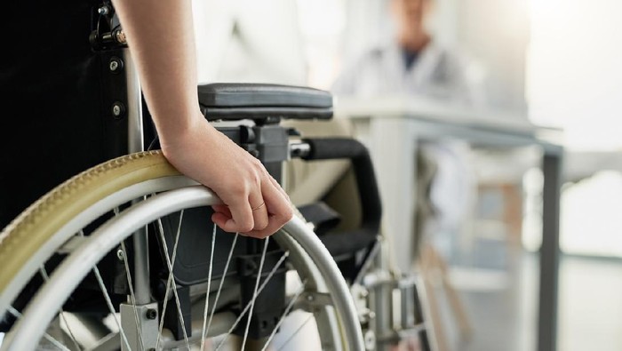 Cropped shot of an unrecognizable woman in a wheelchair visiting the doctors rooms for a consultation