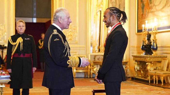 Lewis Hamilton Lewis Hamilton is made a Knight Bachelor by Britain's Prince Charles at Windsor Castle, in Windsor, England, Wednesday, Dec. 15, 2021. (Dominic Lipinski/PA via AP)