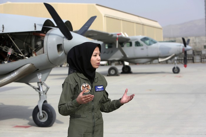 In this Monday, Nov. 21, 2016, photo, Capt. Safia Ferozi, 26, speaks in an interview with the Associated Press after her flight, at the Afghan military airbase in Kabul, Afghanistan. From a childhood as a refugee, Capt. Safia Ferozi is now flying a transport plane for Afghanistan’s air force as the country’s second female pilot, a sign of the efforts to bring more women into the armed forces. (AP Photo/Rahmat Gul)