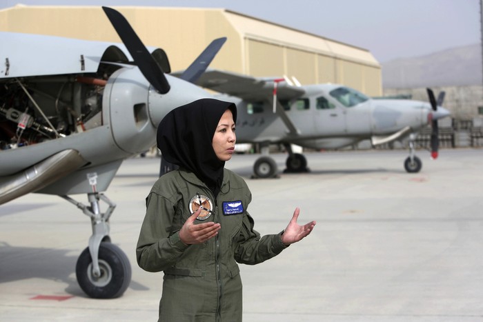 Afghanistan Female Pilot In this Monday, Nov. 21, 2016, photo, Capt. Safia Ferozi, 26, speaks in an interview with the Associated Press after her flight, at the Afghan military airbase in Kabul, Afghanistan. From a childhood as a refugee, Capt. Safia Ferozi is now flying a transport plane for Afghanistan’s air force as the country’s second female pilot, a sign of the efforts to bring more women into the armed forces. (AP Photo/Rahmat Gul)