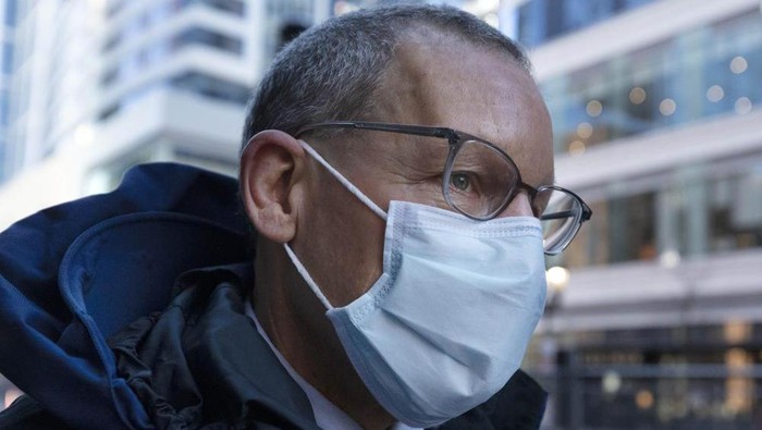 Harvard University professor Charles Lieber leaves federal court, Tuesday, Dec. 14, 2021, in Boston. Lieber is charged with hiding his ties to a Chinese-run recruitment program. His trial is the latest bellwether in the U.S. Justice Departments controversial effort to crackdown on economic espionage by China. (AP Photo/Michael Dwyer)