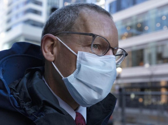 Harvard University professor Charles Lieber leaves federal court, Tuesday, Dec. 14, 2021, in Boston. Lieber is charged with hiding his ties to a Chinese-run recruitment program. His trial is the latest bellwether in the U.S. Justice Departments controversial effort to crackdown on economic espionage by China. (AP Photo/Michael Dwyer)