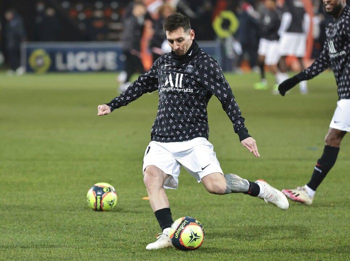 PSG's Lionel Messi warms up before the French League One soccer match between FC Lorient and Paris Saint-Germain at the Moustoir stadium in Lorient, western France, Wednesday, Dec. 22, 2021. (AP Photo/Jeremias Gonzalez)
