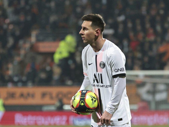 PSG's Lionel Messi holds the ball during the French League One soccer match between FC Lorient and Paris Saint-Germain at the Moustoir stadium in Lorient, western France, Wednesday, Dec. 22, 2021. (AP Photo/Jeremias Gonzalez)
