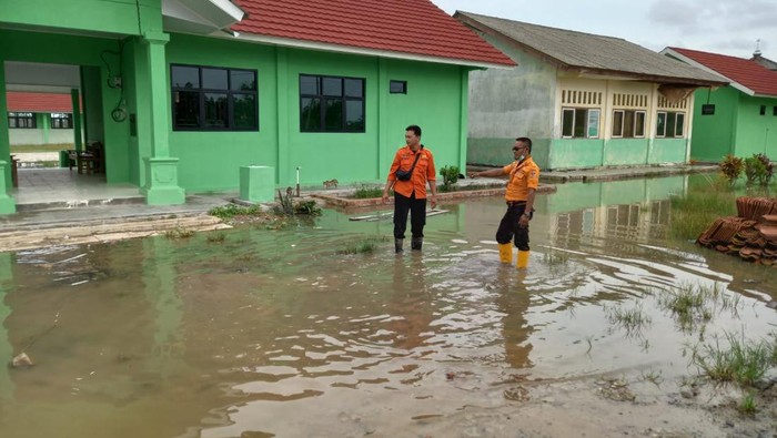 Kondisi banjir yang masih menggenangi wilayah Kecamatan Mesuji pada Senin siang (27/12). (dok BNPB)