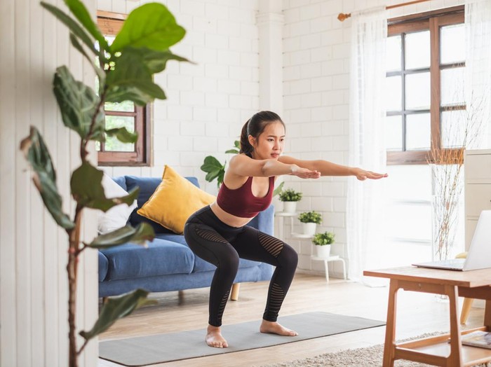 Young Asian healthy woman workout at home, exercise, fit, doing yoga, home fitness concept