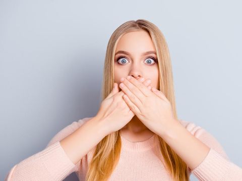 Discuss palm privacy chatter communication person lifestyle message concept. Close up portrait of charming cute innocent amazed wondered manager covering mouth with hands isolated on gray background